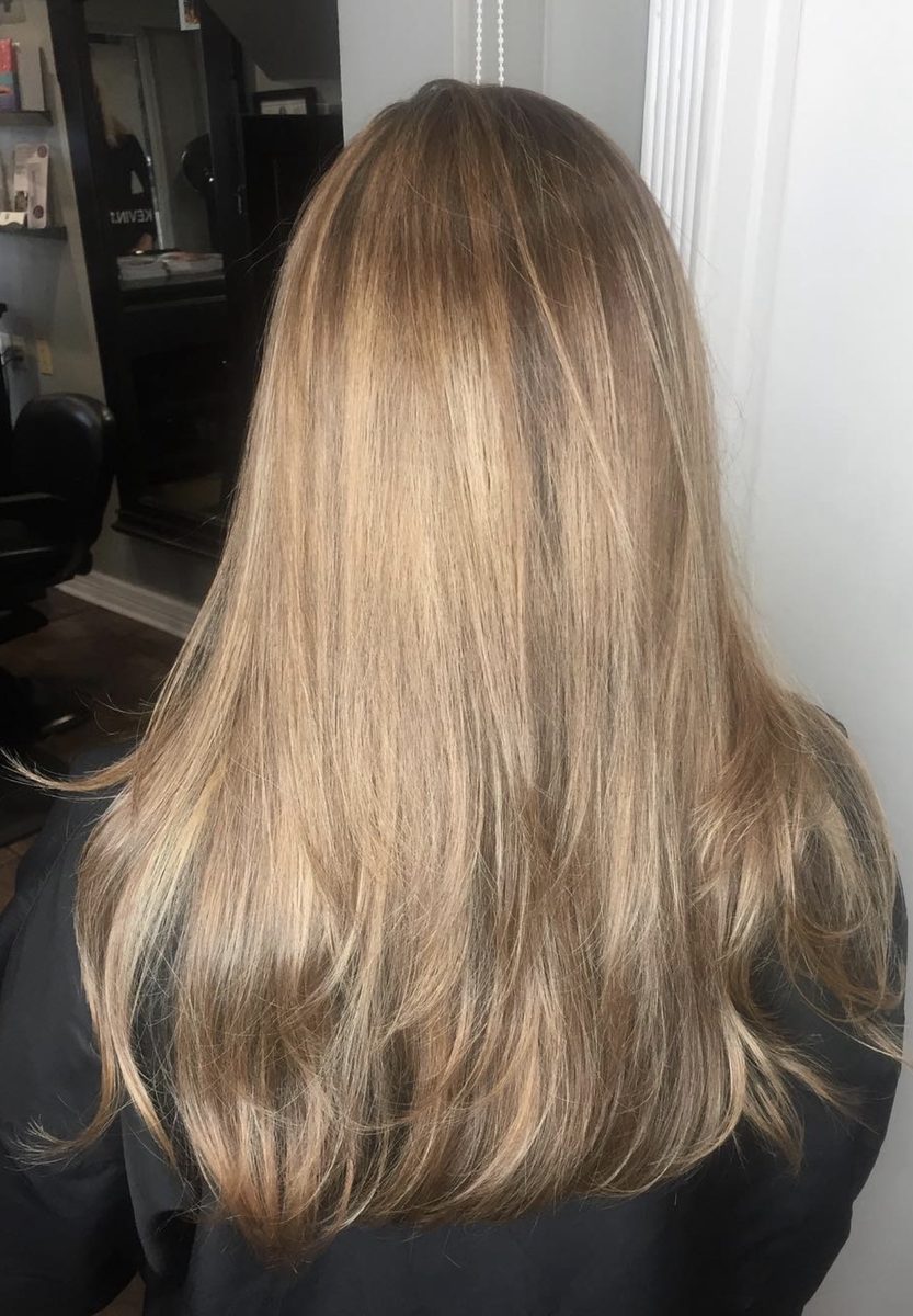 Honey blonde balayage with subtle dimension